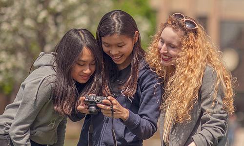 three 博天堂官方入口登陆登录 students looking at a camera.